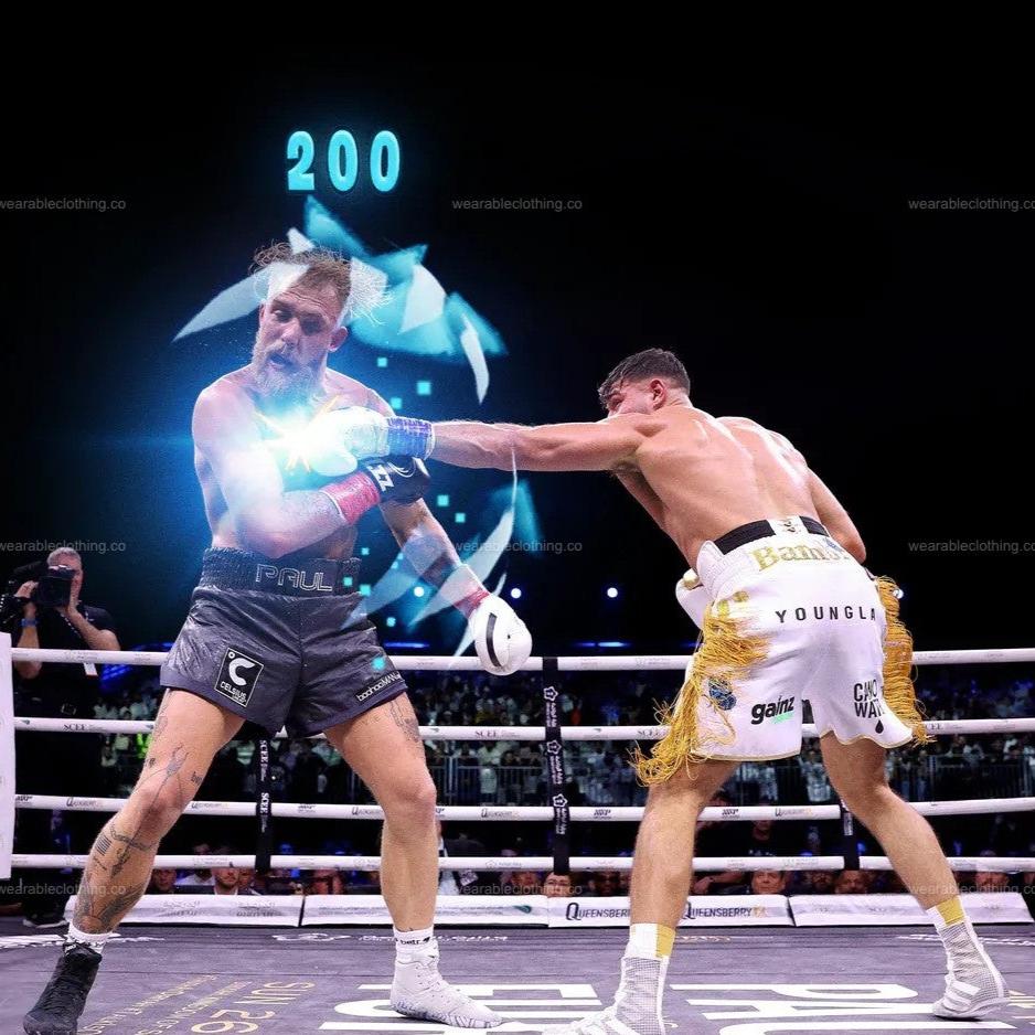 Black T-shirt with Jake Paul getting 200 pumped by Tommy Fury