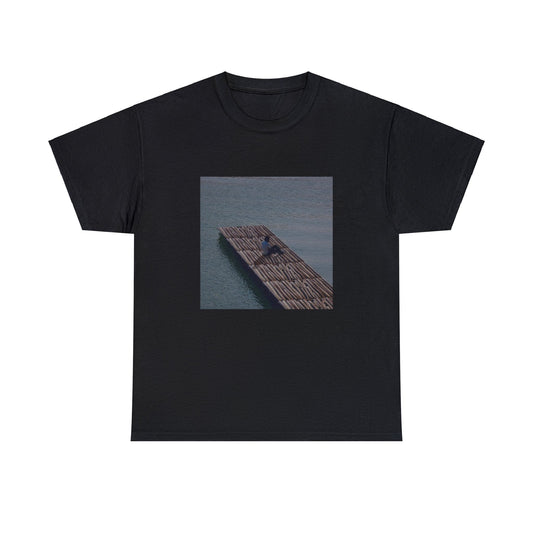 Black T-shirt with the cover of Baby Keem’s The Melodic Blue studio album, but the floor is made of Fortnite wood build